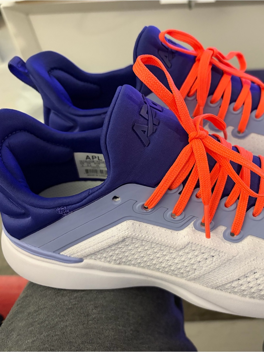 APL women’s White & Purple Athletic Shoes with Bright Orange Laces